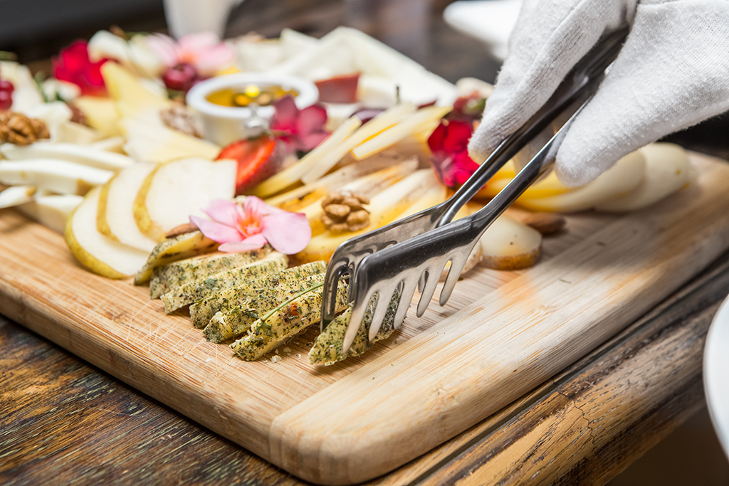 butler serving cheese